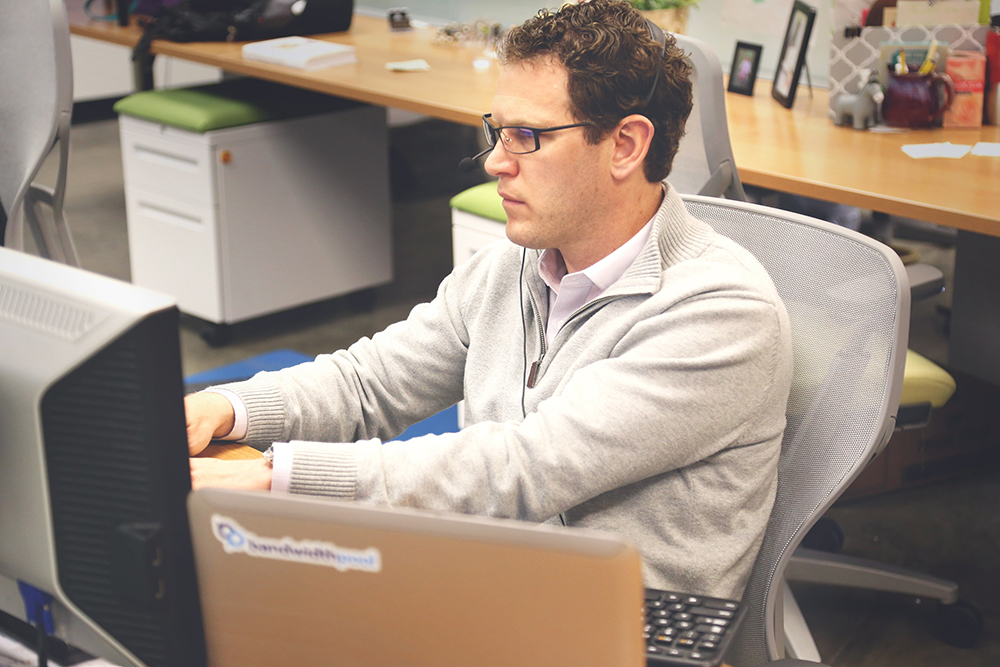 A die designer at work on a computer